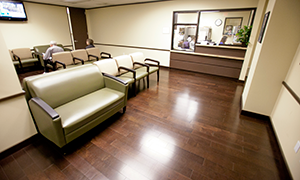dr stokes, spine surgeon, consults with patient at texas spine center